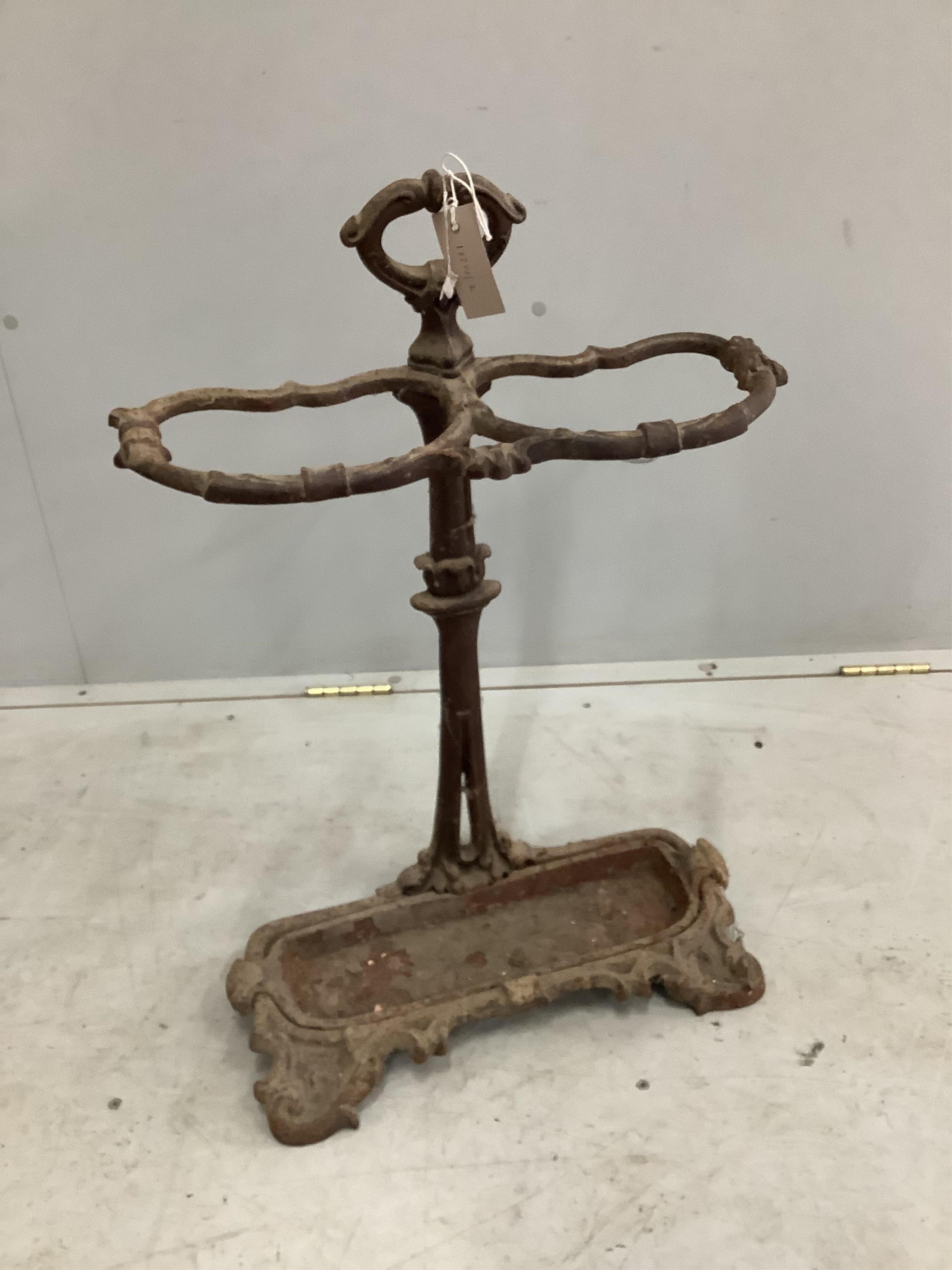 A Victorian cast iron stick stand, height 70cm. Condition - poor as paint loss and oxidised